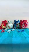 Stunning handcrafted potli bags showcasing exquisite artistry and timeless charm - Drape In A Minute Sarees